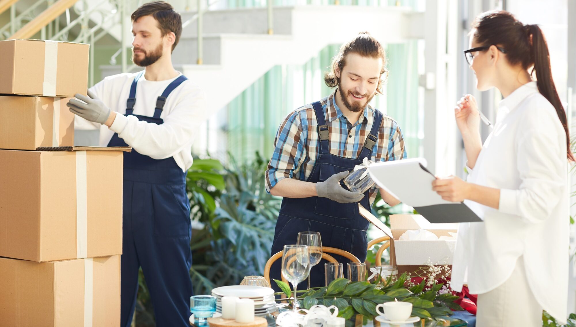 Female manager making notes in report while taking delivery